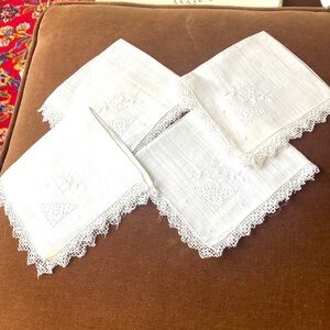 Four vintage linen cocktail napkins. With flower embroidery and cut work detail